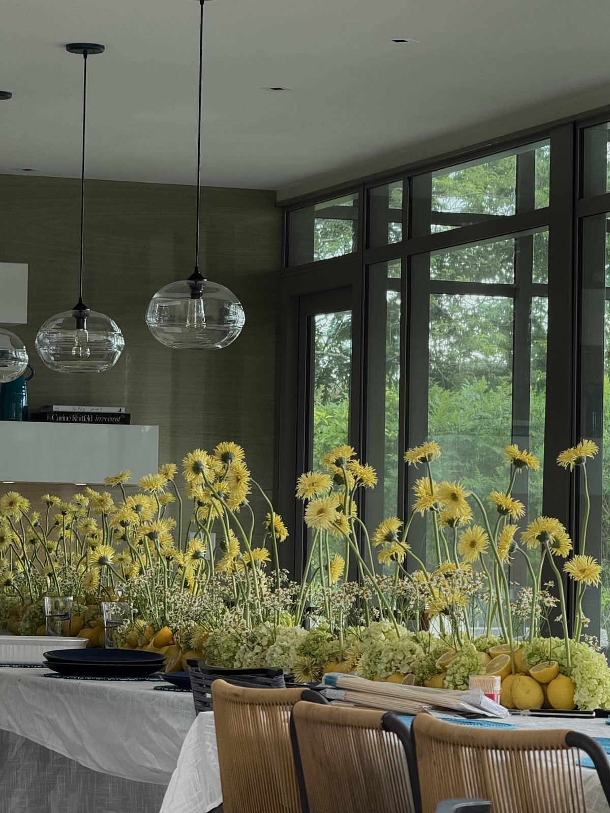 Lemon and gerbera daisy centrepiece at an evening dinner, Martha's Vineyard, by Kuration Studio